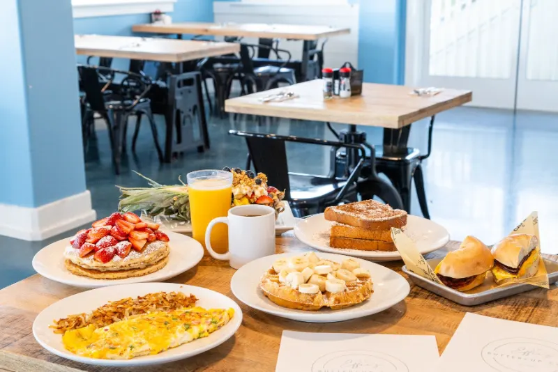 Pancakes with strawberries, a banana waffle, omelet and French toast at Effie's Buttercup Cafe