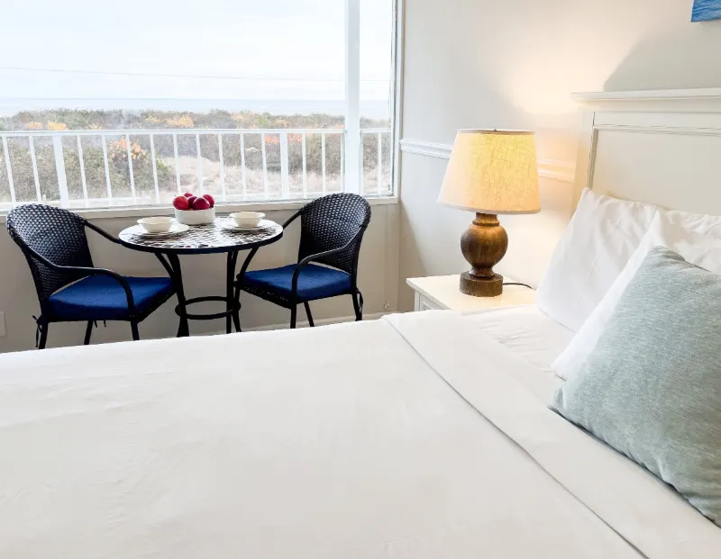 Oceanfront room with a king bed and a window looking out over the ocean